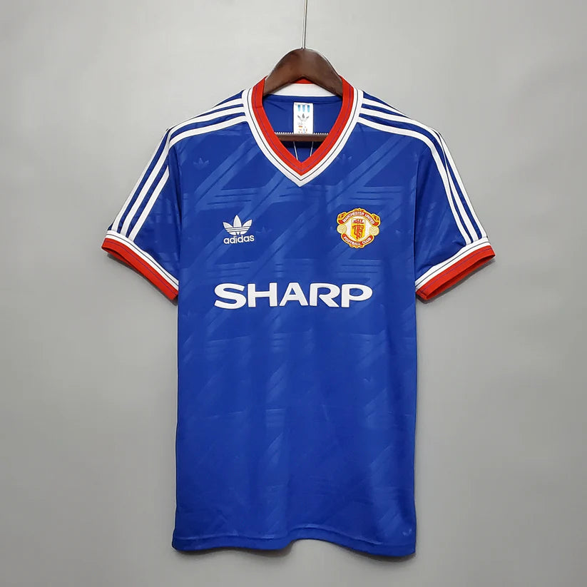 Man utd blue shirt deals